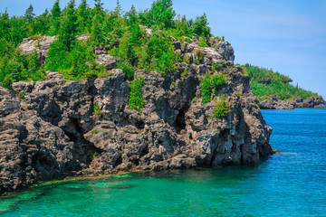 Plakat amazing stunning gorgeous landscape view with cliffs rocks above great Cyprus lake tranquil turquoise water at beautiful gorgeous Bruce Peninsula, Ontario