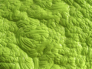 Bright green polymer mass with a gloss flat, dough or mud like structure in green shades
