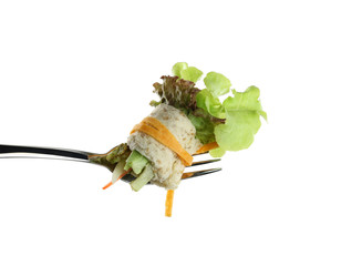 roll salad on fork isolated on white.