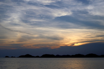 Naklejka na ściany i meble Blurred scene of sea water at sunset background.