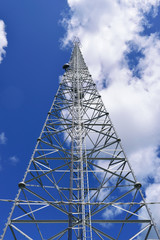 Radio and Cellular Tower with Blue Sky Background