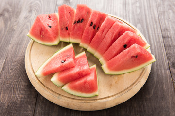 Healthy slice watermelon on a wood background