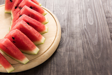 Healthy slice watermelon on a wood background