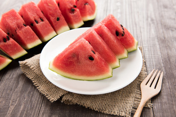 Healthy slice watermelon on a wood background