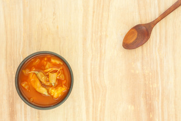 Spicy sour soup vegetable on wooden background