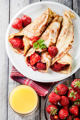 Traditional crepes served with strawberries