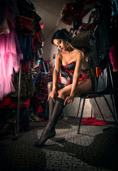 Young sexy cabaret female dancer in dressing room, backstage