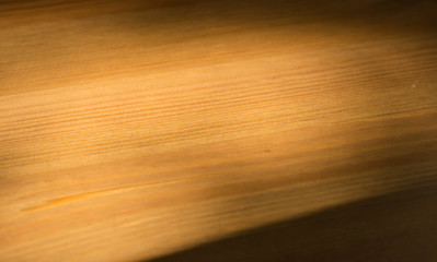 The wooden background lit with the sun