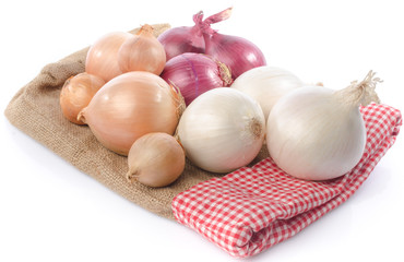Obraz na płótnie Canvas Different types of onions on burlap