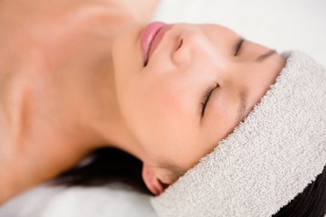 Obraz na płótnie Canvas Relaxed woman lying on the massage table
