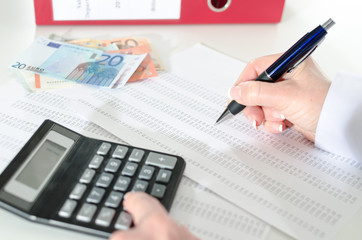 Woman accountant with calculator