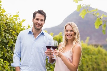 Young happy couple smiling at camera