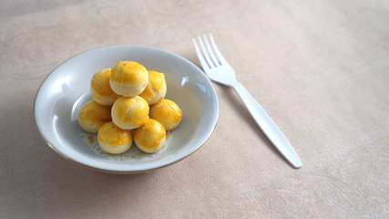 some sweet nastar (traditional cheesecake from indonesia) on a p