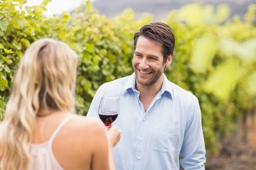 Young happy man smiling at woman