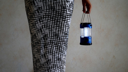 a women holding a lantern