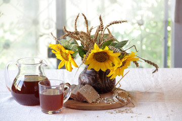 Still-life with kvass (kvas) and sunflowers