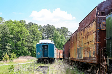 Obraz premium Blue Rail Car by Rusty Train