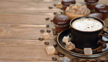 Obraz na płótnie Canvas Cup of coffee and chocolate muffins