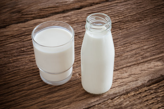 fresh milk in glass bottle and glass