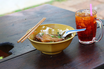Chicken noodle with ice tea in Thailand