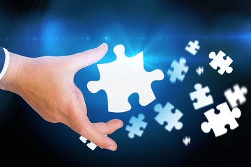 Composite image of businessman pointing with his finger