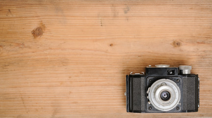 retro camera on wooden background