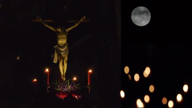     Christ of silence with full moon and candlelight blurred                                                                             
