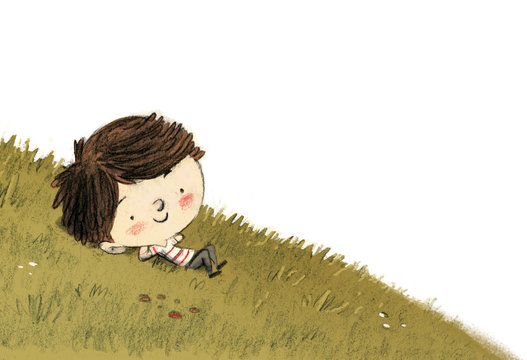 niño tumbado en un prado