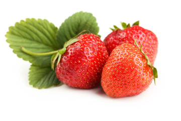 Strawberries with leafs isolated on a white