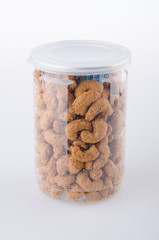 roasted cashew nuts in jar on background