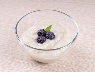 Glass bowl with berries in the center.