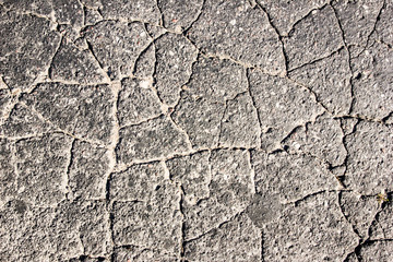 Cracked asphalt grunge texture.