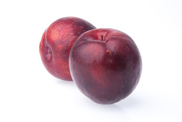 Plum. Ripe plum fruit on background