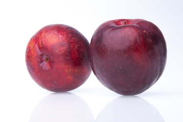 Plum. Ripe plum fruit on background