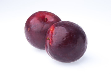 Obraz premium Plum. Ripe plum fruit on background