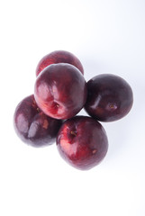 Plum. Ripe plum fruit on background