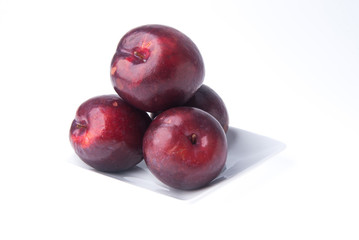 Plum. Ripe plum fruit on background