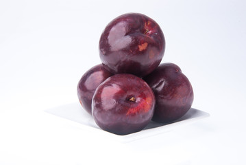 Plum. Ripe plum fruit on background