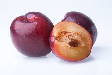 Fototapeta na wymiar Plum. Ripe plum fruit on background