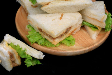 tuna sanwich on black background