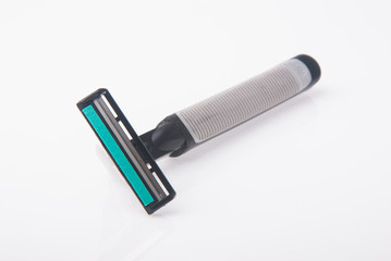 Safety shaver or razor on background