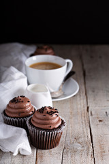 Chocolate cupcakes with a cup of coffee