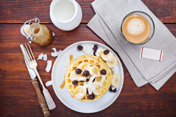 Waffles with banana slices and chocolate