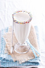 White chocolate milkshake in tall glass