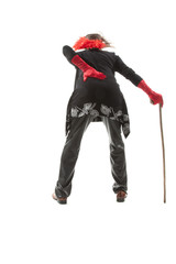 Actor in senior lady clothes with cane