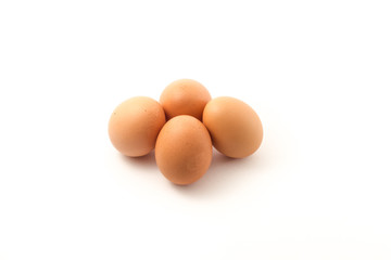 Four eggs in group isolate on white