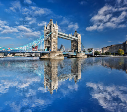 Famous Tower Bridge with flag of England in London, UK