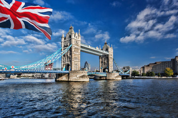 Fototapeta na wymiar Famous Tower Bridge with flag of England in London, UK