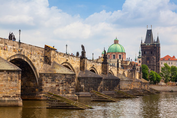 Fototapeta na wymiar Charles Bridge in Prague with tower and church