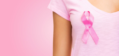 close up of woman with cancer awareness ribbon